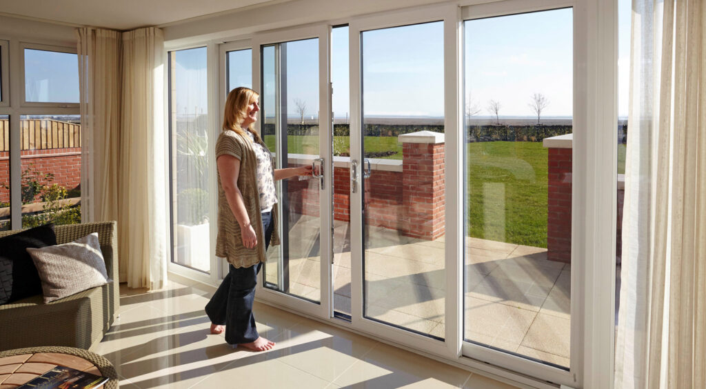 Lady opening patio sliding door